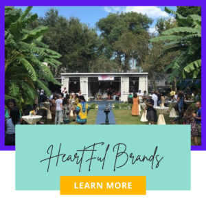 Outdoor event with people and stage setup.